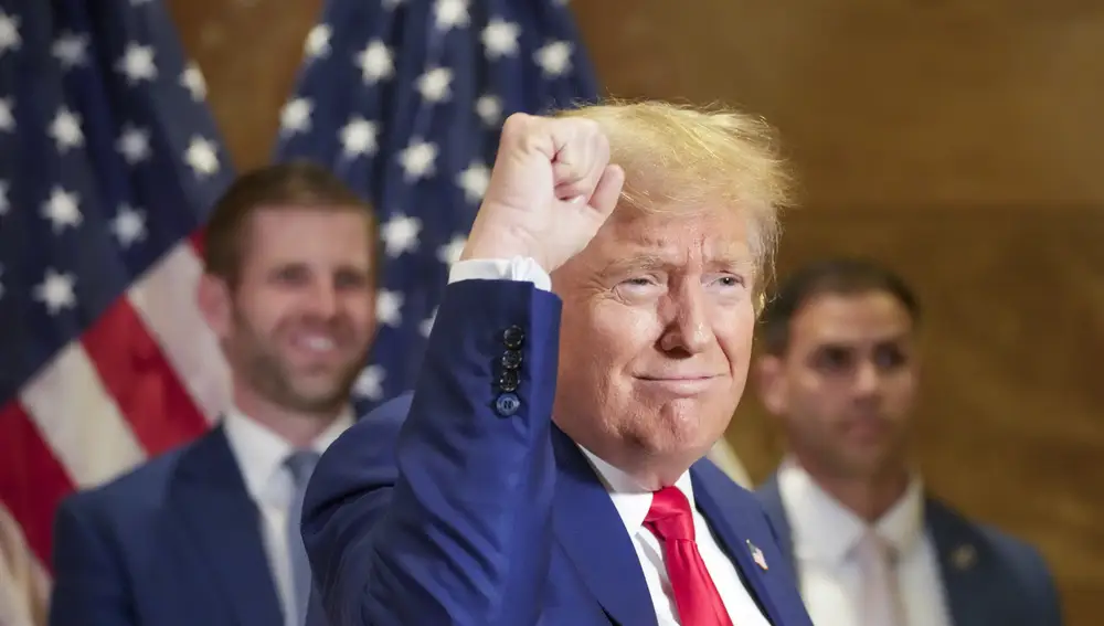 eric-trump-left-smiles-former-president-donald-trump-thanks-supporters-who-were-cheering-him-after-news-conference-thursday-jan-11-2024-new-york_58