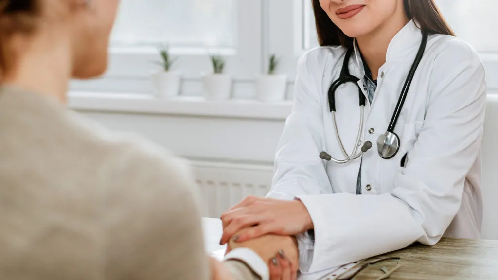 friendly-female-doctor-holding-female-patient-s-hand-encouragement-empathy-1024x576